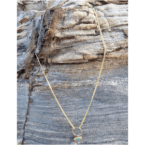 Our Tamarama Evil Eye Choker features a playful twist to our favourite ancient symbol; the evil eye. . This piece features a beautiful pendant suspending on a gold ring interlocked on each side by a fine chain.   Material:  18K Gold Vermeil with a Sterling Silver base  Dimension:   33 cm (5cm extension) 